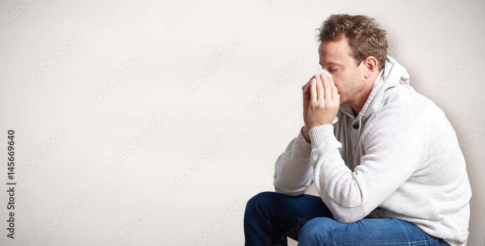 sneezing man with cold sneezing man with cold