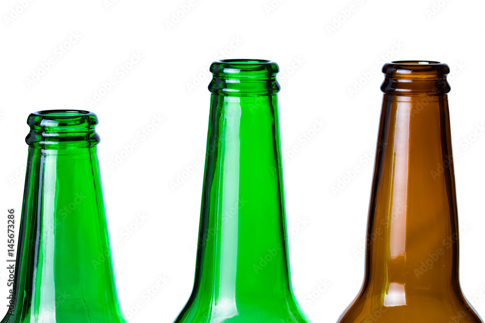 Green and brown glass bottles necks isolated on white.