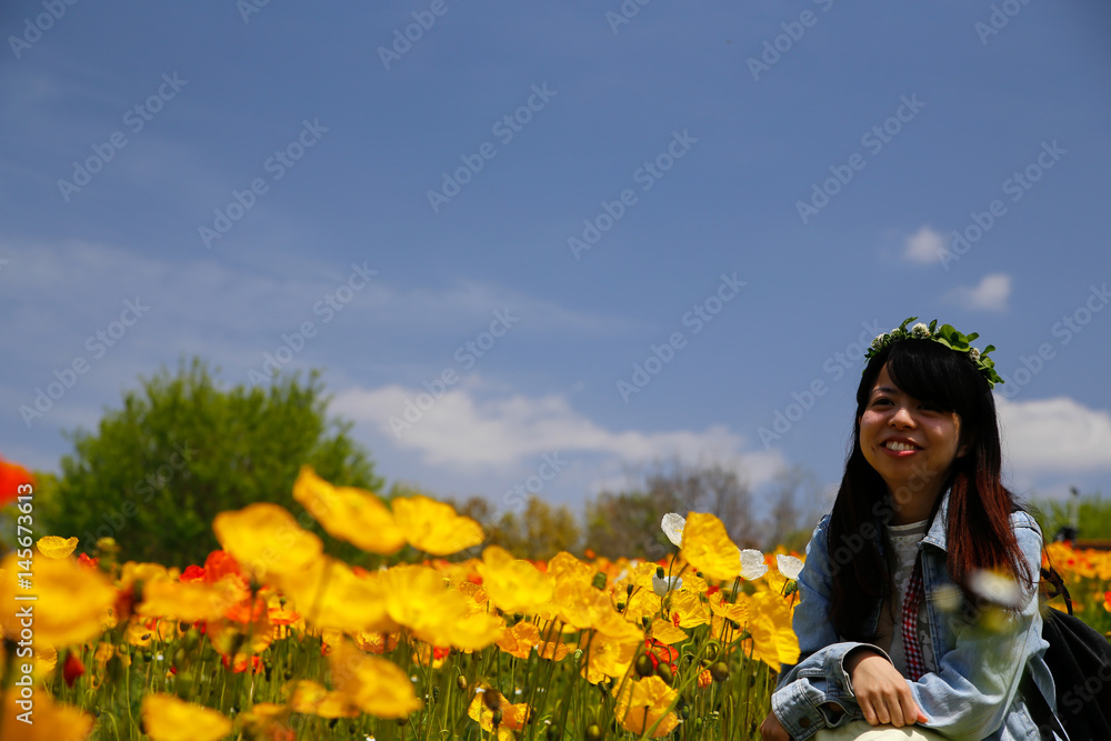 japanese young lady with flower crown in flower garden japanese young lady with flower crown in flower garden