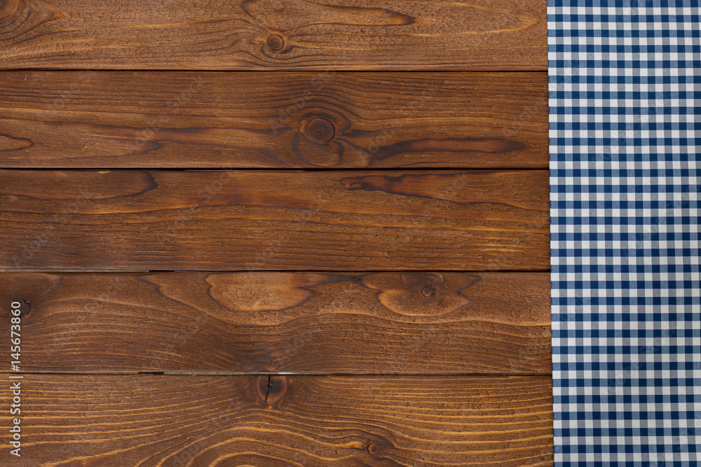 Background with empty wooden table with tablecloth Background with empty wooden table with tablecloth