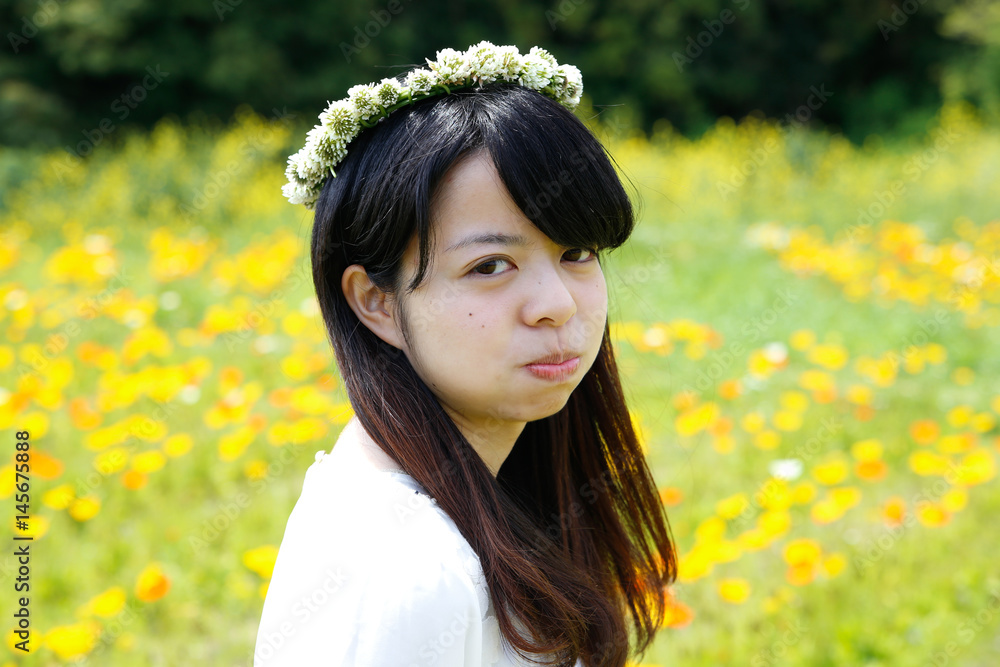 young Japanese lady in Flower garden young Japanese lady in Flower garden