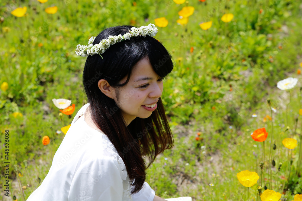 young Japanese lady in Flower garden young Japanese lady in Flower garden