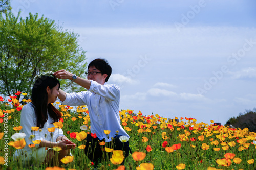 young Japanese couple in Flower garden 