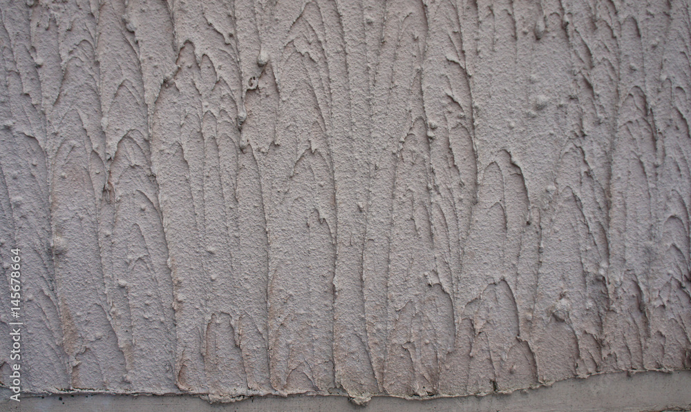 Texture - the wall is covered with light gray coarse plaster. Texture - the wall is covered with light gray coarse plaster.