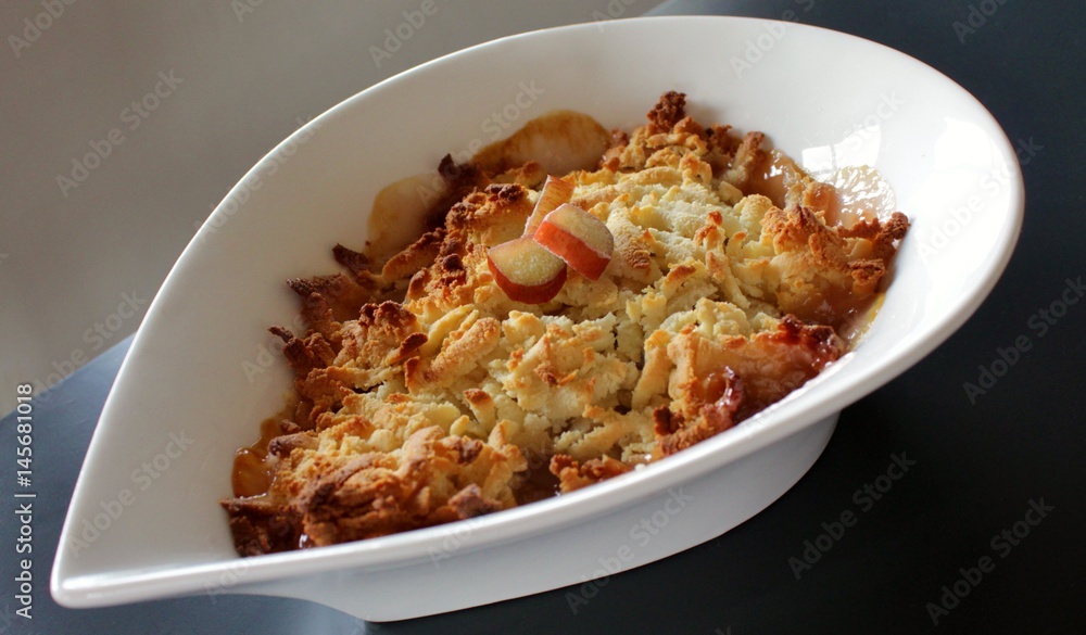 Baked rhubarb crumble topped with grated marzipan Baked rhubarb crumble topped with grated marzipan