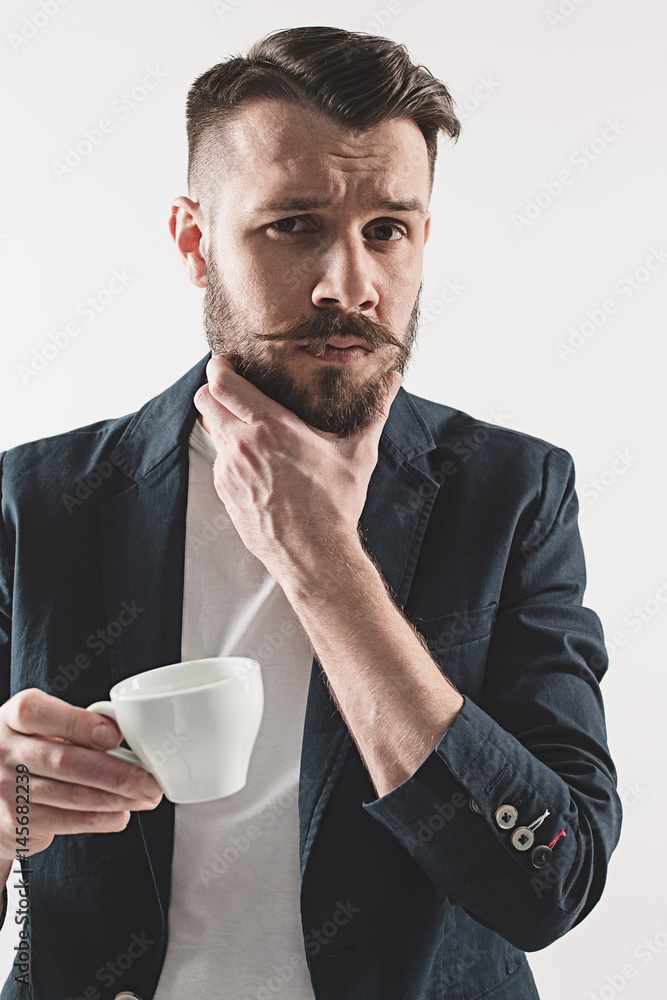 Portrait of stylish handsome young man with cup of coffee Portrait of stylish handsome young man with cup of coffee