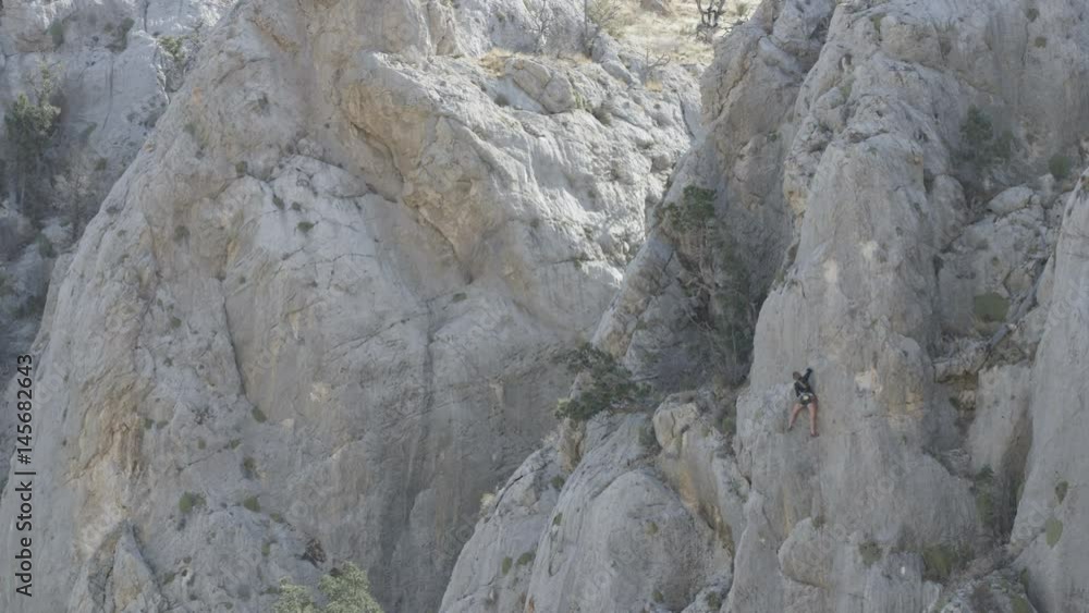 girl rock climbing on large wall girl rock climbing on large wall