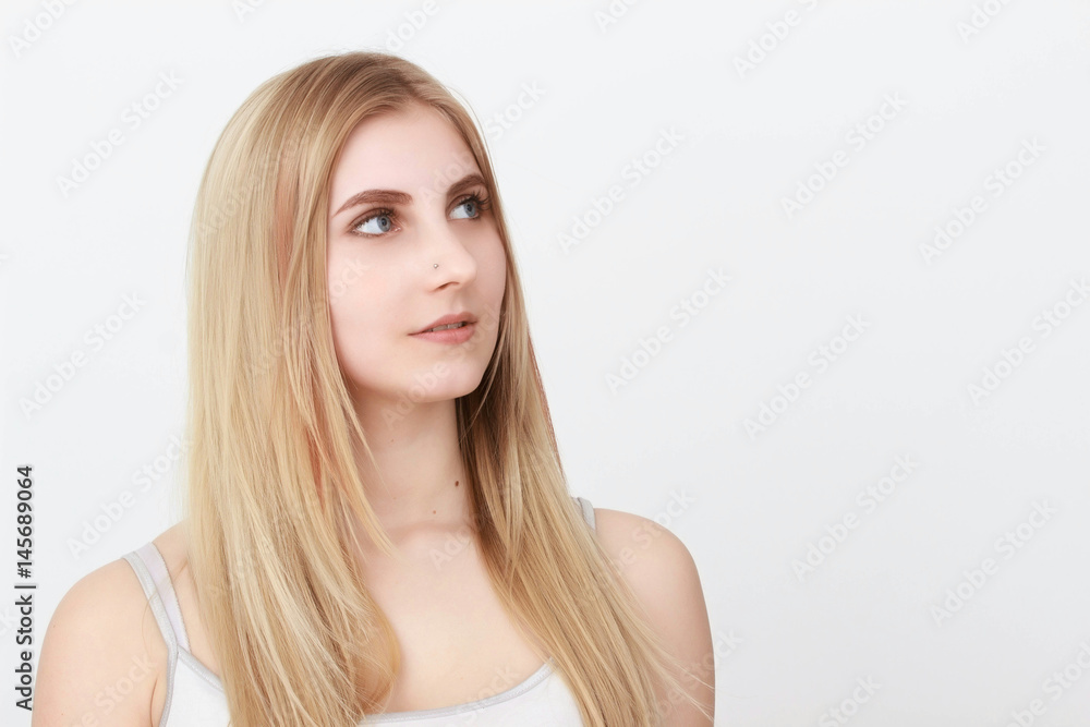 Closeup portrait of a beautiful young blond woman with clean face Closeup portrait of a beautiful young blond woman with clean face