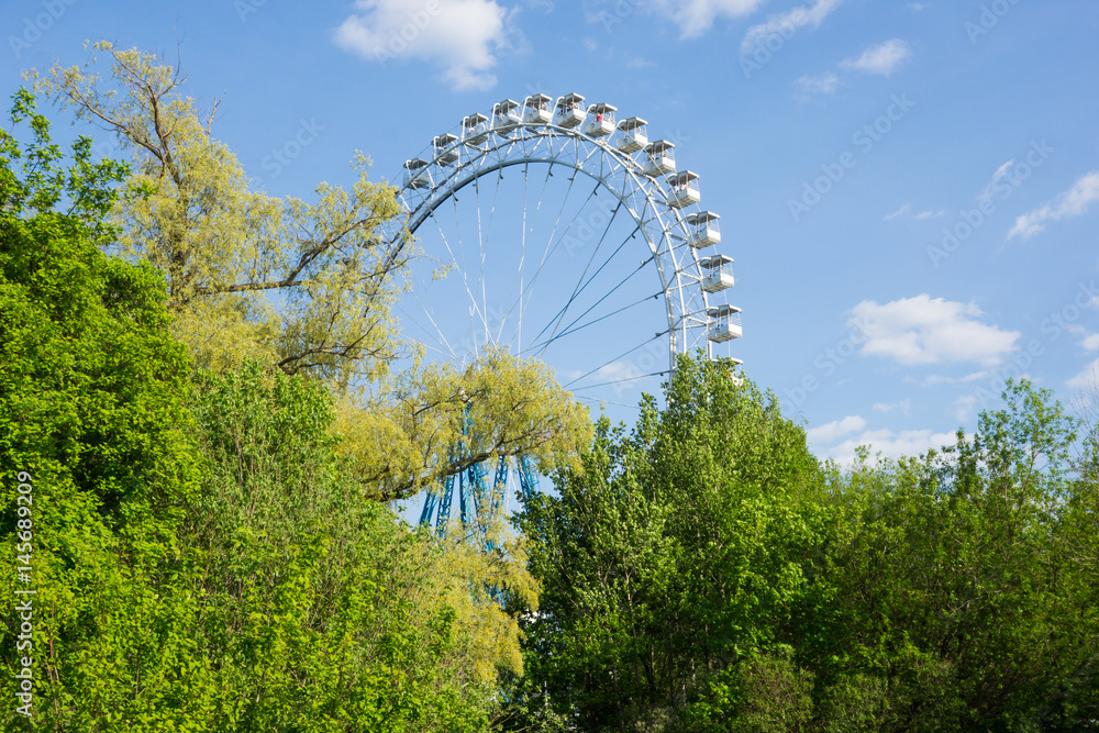 Ferris wheel in the summer morning Ferris wheel in the summer morning