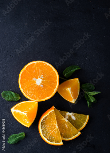 Citrus slices and mint herbs © YuliiaMazurkevych