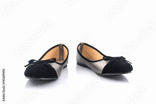 Black and gold color woman shoes.