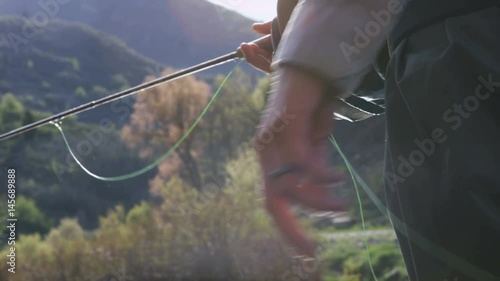 close up of hand casting while fishing