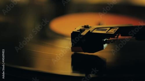 A retro-styled spinning record vinyl player. 4k. Close up.