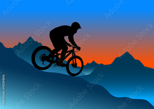 Fototapeta Naklejka Na Ścianę i Meble -  Silhouette of a cyclist riding a mountain bike