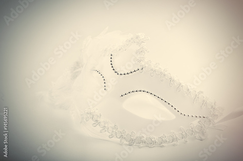 photo of beautiful masquerade mask on the wonderful white studio background