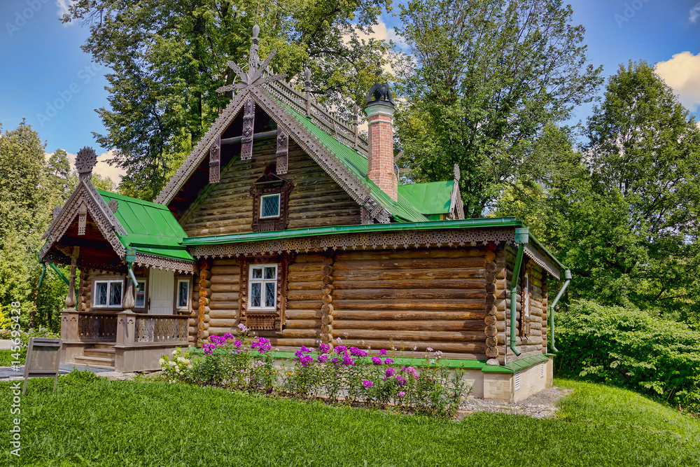 The ancient wooden house in the noble estate in Russia