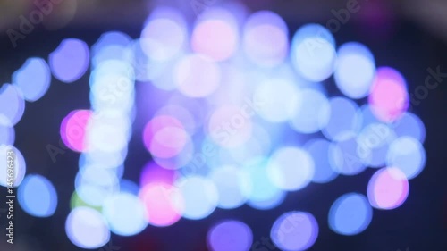 Highlighted bokeh glowing iridescent water fountain in the shopping mall, play bottom, Steady cam, slow mo shot photo