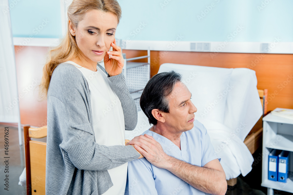 Obraz premium wheelchair man with wife near by in hospital chamber
