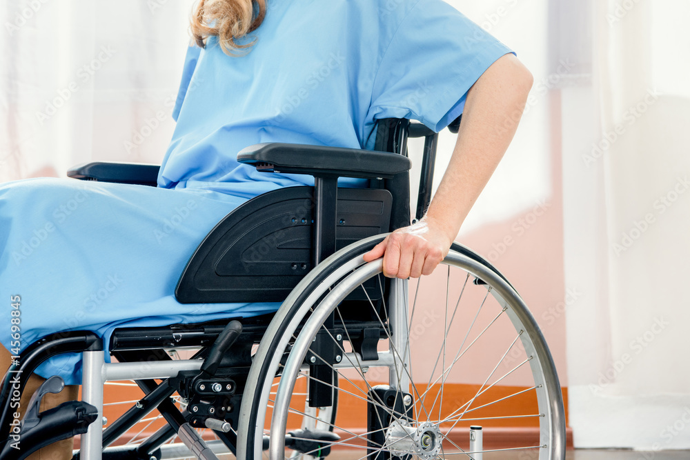 partial view of wheelchair woman in hospital chamber