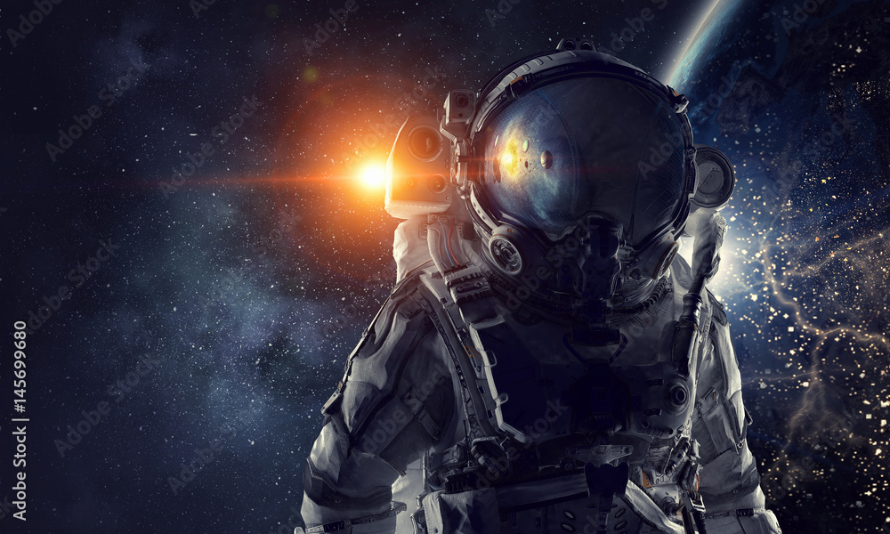 Fototapeta premium Astronauta w kosmosie. Różne środki przekazu