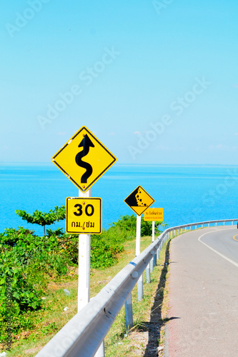 road sign with sea 