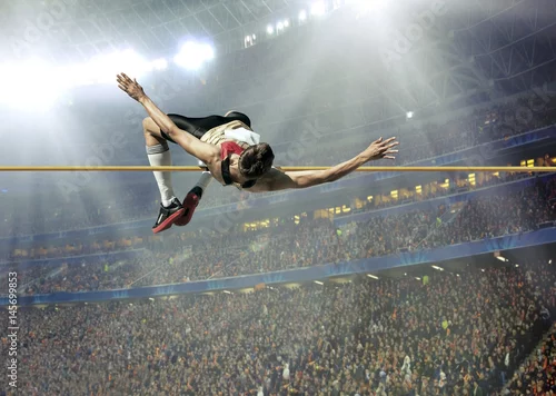 Obraz Sportowiec w akcji skoku wzwyż.