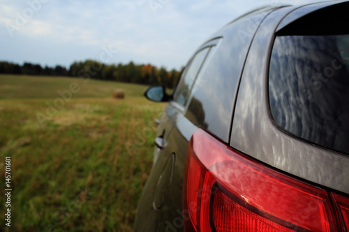 Платно Car in the field forest sky