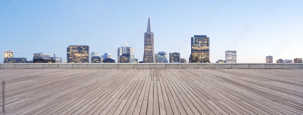 Fototapeta premium empty wooden floor with cityscape of modern city
