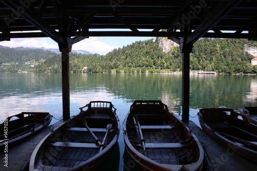 Bled lake in Slovenia. Notice the amazing color of water with boats in dark area