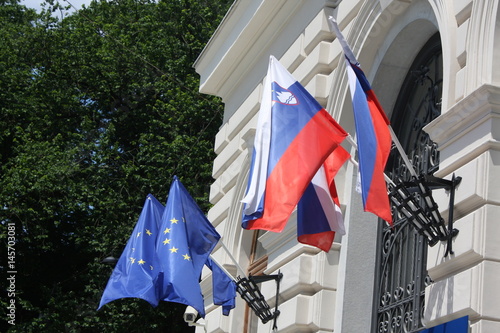 Schilderij op canvas Ljubljana city with  EU flags and Slovenian flags, Slovenia