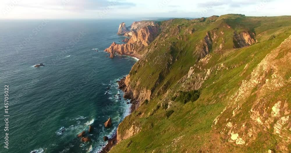 High coastline, Cabo da Roca, Portugal. Aerial view of mountains near Atlantic ocean. High coastline, Cabo da Roca, Portugal. Aerial view of mountains near Atlantic ocean.