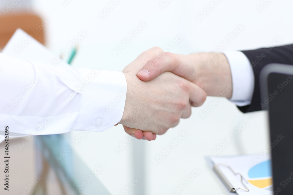 Close up view of business partnership handshake concept.Photo of two businessman handshaking process.Successful deal after great meeting.Horizontal,flare effect, blurred background Close up view of business partnership handshake concept.Photo of two businessman handshaking process.Successful deal after great meeting.Horizontal,flare effect, blurred background