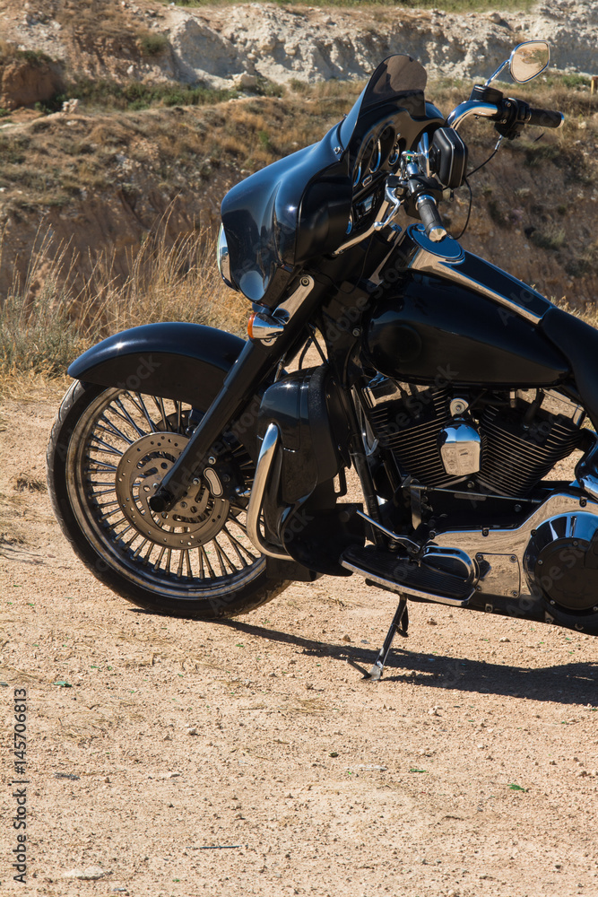 Front motorcycle/sportbike disk and tire in close up. Prairie, steppe in summer. Front motorcycle/sportbike disk and tire in close up. Prairie, steppe in summer.