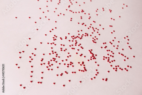 Heaps of red glass beads © evdokimari