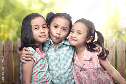 Image of three asian little girl having fun and playing together