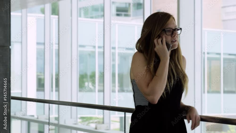 woman pacing while on the phone woman pacing while on the phone