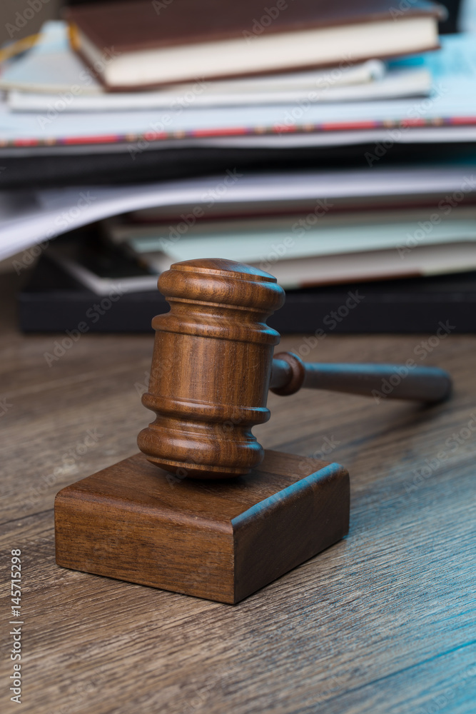 Hammer of judge against folder Hammer of judge against folder