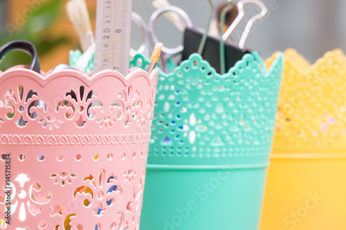 Colorful baskets, tapes and laces, and other tools for scrapbooking and handmade