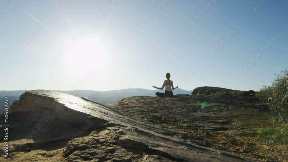 woman doing yoga in the desert woman doing yoga in the desert