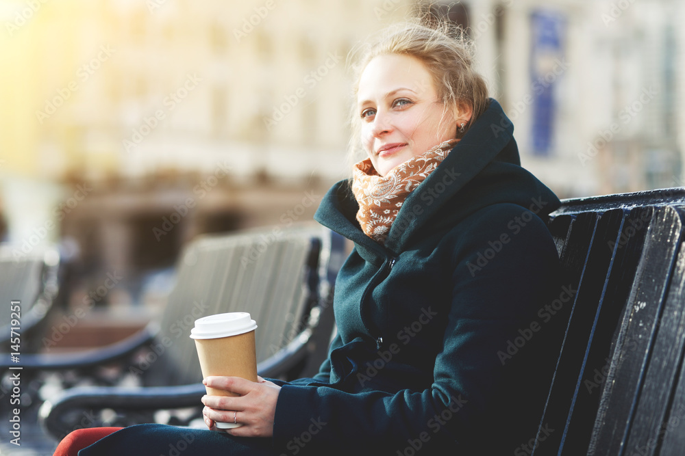 Woman in coat with coffee Woman in coat with coffee