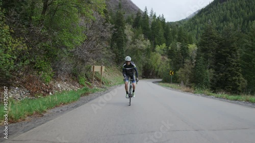 Wallpaper Mural Man road biking through mountains Torontodigital.ca