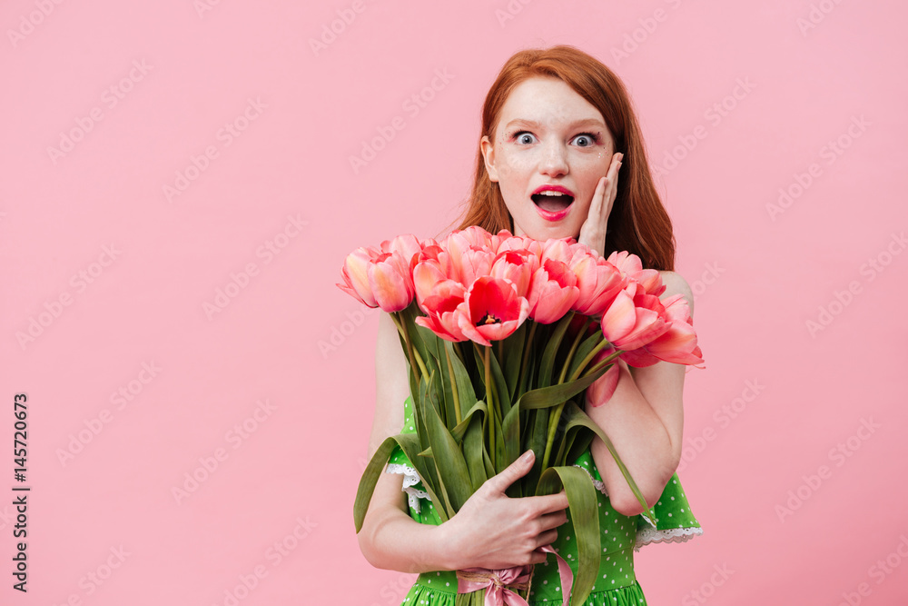 Surprised woman holding bouquet