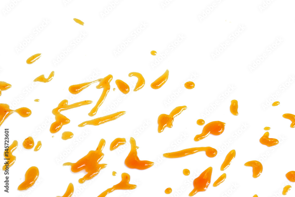 Drops of chilli sauce on white background Drops of chilli sauce on white background