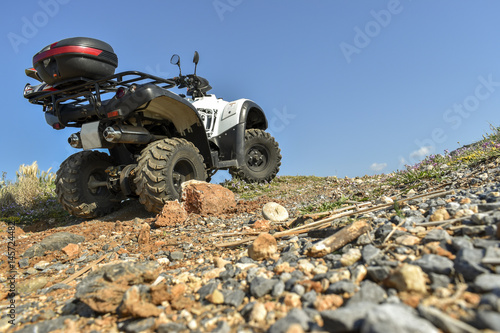 ATV offroad on sea and sky background