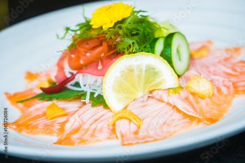 Carpaccio salmon in white plate