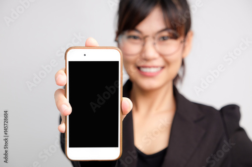Business asian glasses women use cellphone