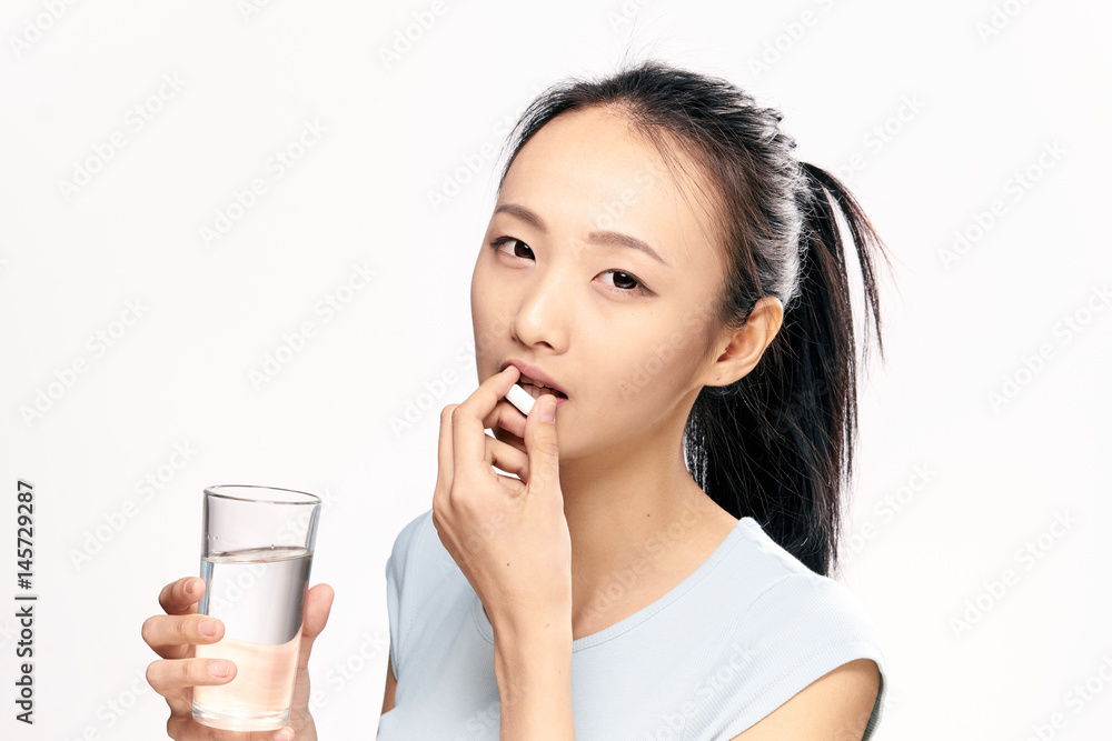 woman with a glass of water, pill, treatment, vitamins woman with a glass of water, pill, treatment, vitamins