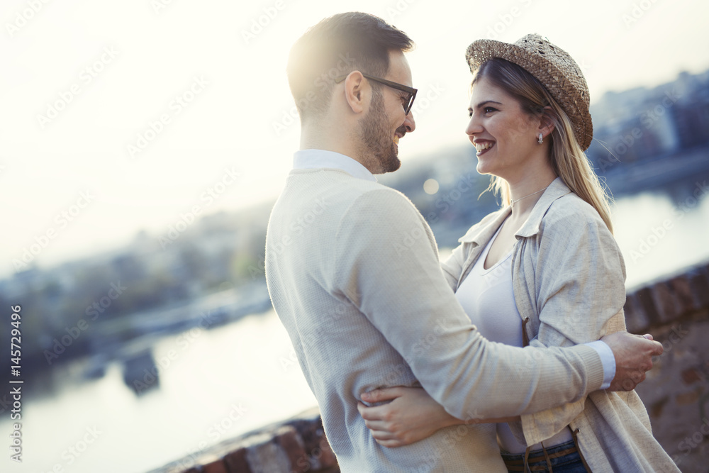 Happy romantic couple hugging and smiling Happy romantic couple hugging and smiling