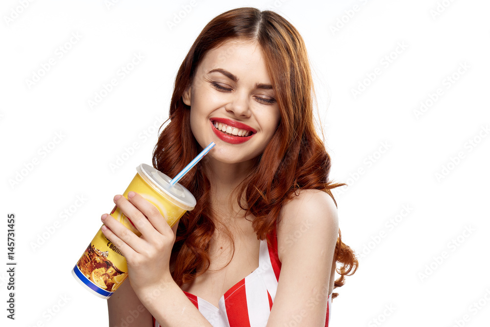 cheerful woman with a plastic glass and a straw