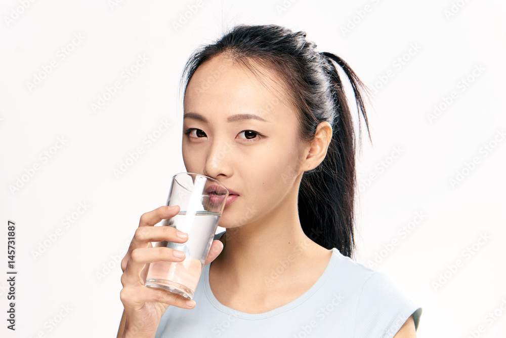 woman drinks clear water woman drinks clear water